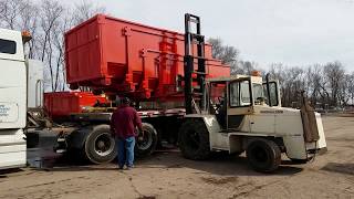 Loading Roll Off Containers  Step Deck Truck [upl. by Yedsnil]