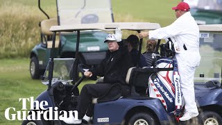 President Trump waves to protesters as he plays golf in Scotland [upl. by Augusto]